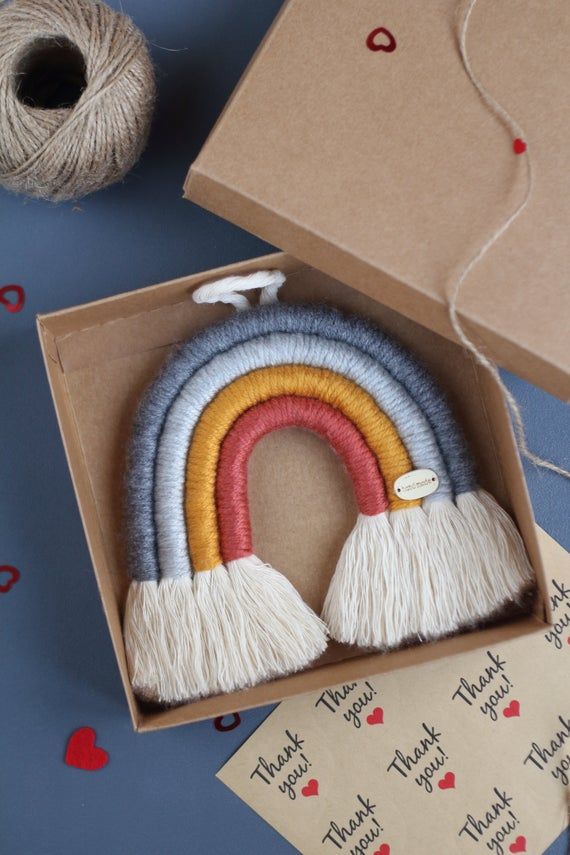 a box that has some kind of crafting kit in it with yarn and scissors