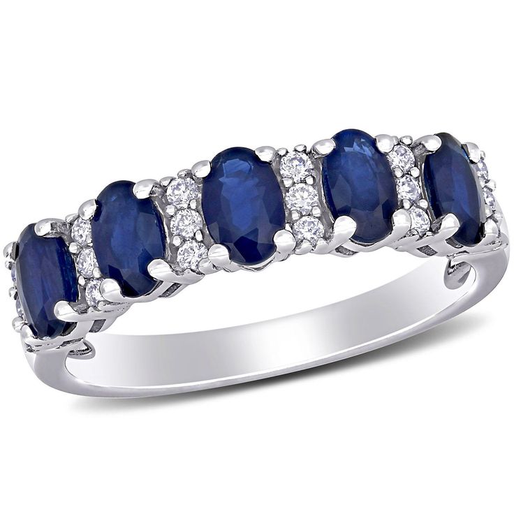 Offer a perfect gift of love with this Blue Sapphire and Diamond Five-Stone Wedding Ring. Crafted in gleaming 14 karat white gold, this ring features oval-cut gemstones and sparkling diamonds studded along five stone pattern. This eye-catching ring is an ideal choice to wear with both casual or evening attire. The ring arrives in a beautiful gift box and is ready for gifting. Sapphire Silver Ring, Blue Gemstone Rings, Peoples Jewellers, Wedding Anniversary Rings, Blue Sapphire Diamond, Blue Sapphire Rings, Diamond Sizes, Sparkle Diamonds, Diamond Stone