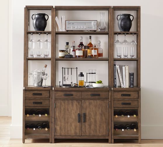 a wooden cabinet with bottles and glasses on it