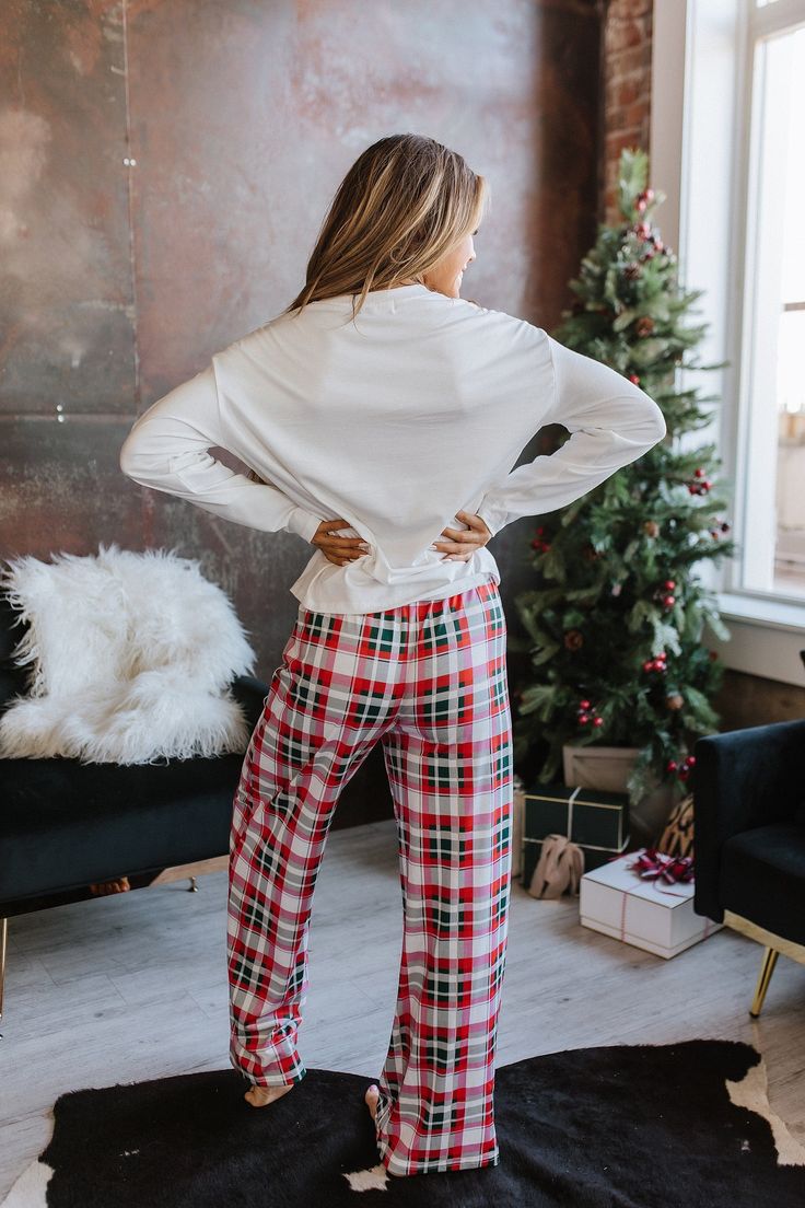 Wrap up in cozy and festive style this season with this Merry Christmas Plaid Pajama Set. Crafted from soft and breathable fabric, its classic plaid design adds a touch of elegance and style to your holiday look. Enjoy festive nights with family and friends in this stylish pajama set, available in sizes S-XL. Model Info: Models are 5'7", Size 2, wearing smalls Fabric: 70% Polyester + 27% Viscose + 3% Elastane Sizes Bust Waist Hem_Width Shoulder Sleeve_Length Length Hip Bottoms Inseam Outseam Relax Relax Relax Relax Relax Relax Relax Relax Relax Relax S 43.3 26.4 44.1 21.3 20.5 22.8 40.2 25.8 29.4 41.3 M 45.7 28.3 46.5 22.4 20.9 23.6 42.5 27.2 29.5 41.7 L 48.0 30.3 48.8 23.6 21.3 24.4 44.9 28.5 29.6 42.1 XL 51.2 33.1 52.0 25.2 21.7 25.2 48.0 30.3 29.6 42.5 Elasticity High December Colors, Simple Christmas Outfits, Holiday Fits, Stylish Pajamas, Trendy Christmas Outfits, Plaid Pajama, Christmas Plaid, Christmas Pjs, Black Seamless