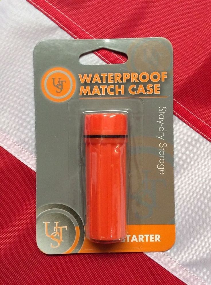 an orange waterproof match case is in the package