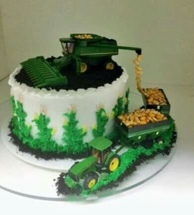 there is a cake that has been made to look like a tractor and farm equipment