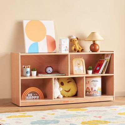 a child's bookshelf with toys and other items on it in a room