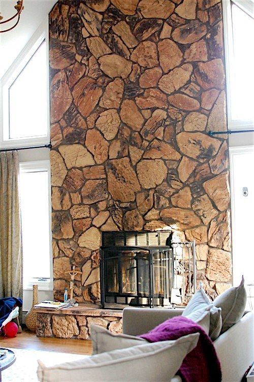 a large stone fireplace in a living room