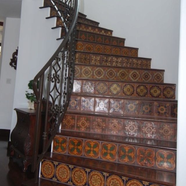 the stairs are decorated with decorative tiles