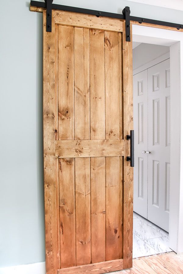 an open wooden door in the corner of a room