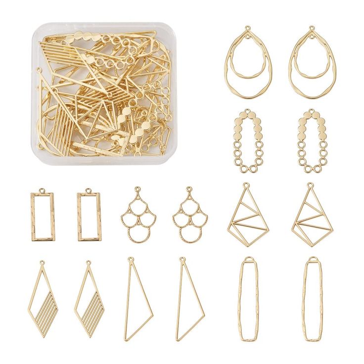 a bunch of different types of earrings and necklaces in a plastic container on a white background