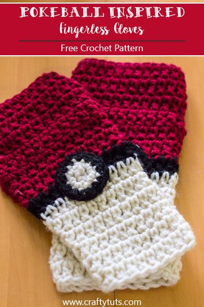 two red and white crocheted mitts sitting on top of a wooden table