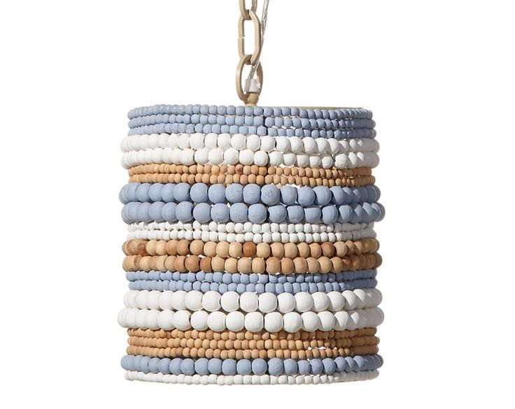 a blue and white beaded lamp hanging from a metal chain on a white background