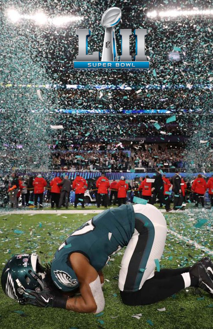 a football player kneels on the field with confetti thrown in the air