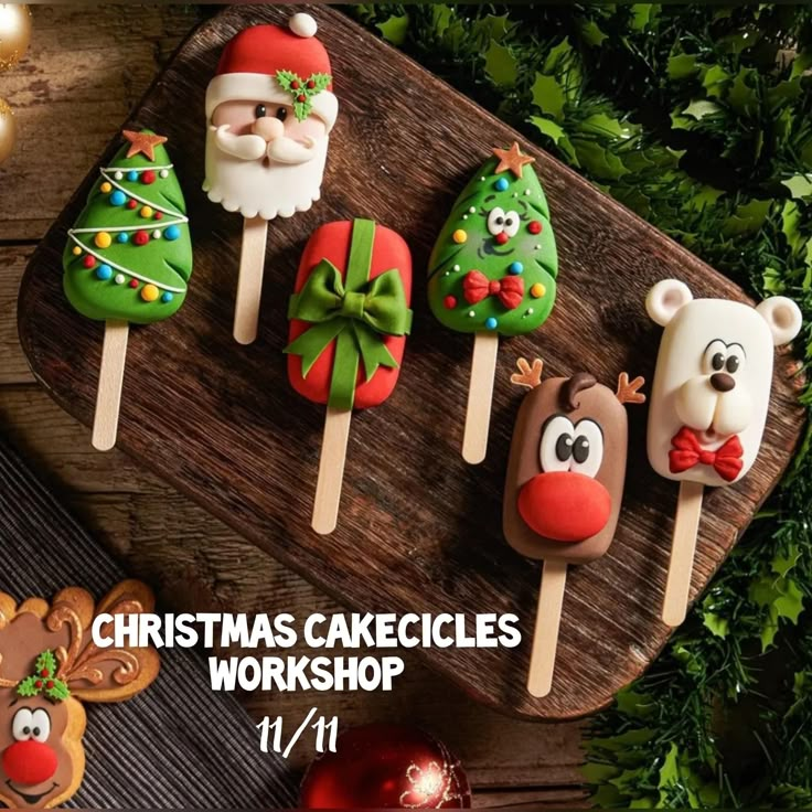 christmas cake pops on a wooden board with reindeer, santa clause and snowman decorations