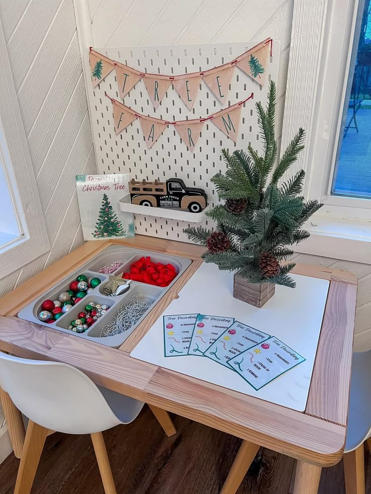 a wooden table topped with lots of trays filled with fruit and veggies