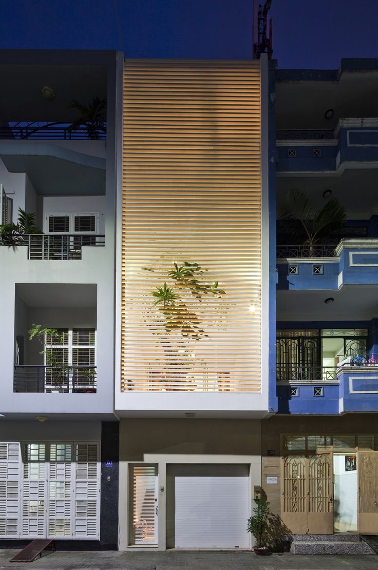 an apartment building with multiple balconies at night