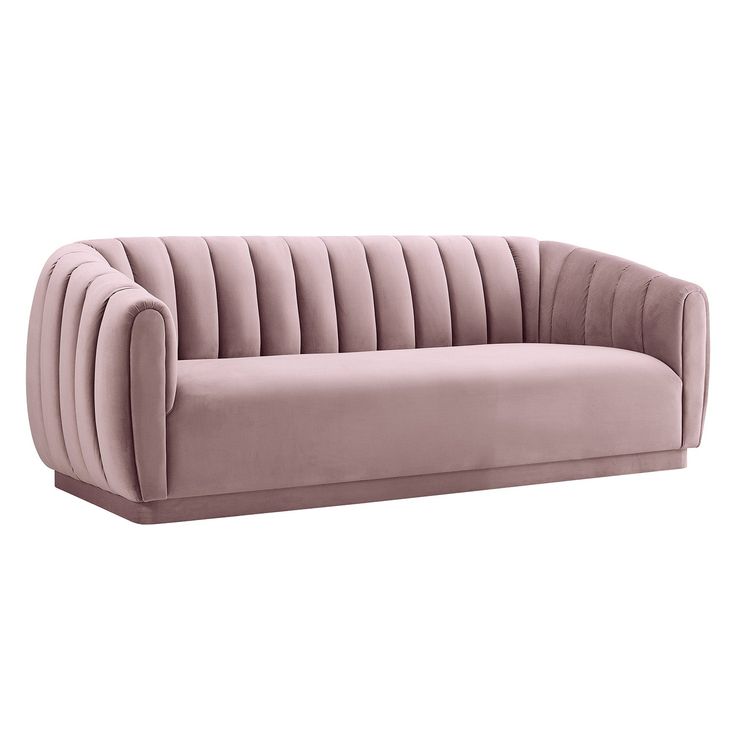 a pink velvet sofa with pleated upholstered back and arms, viewed from the front