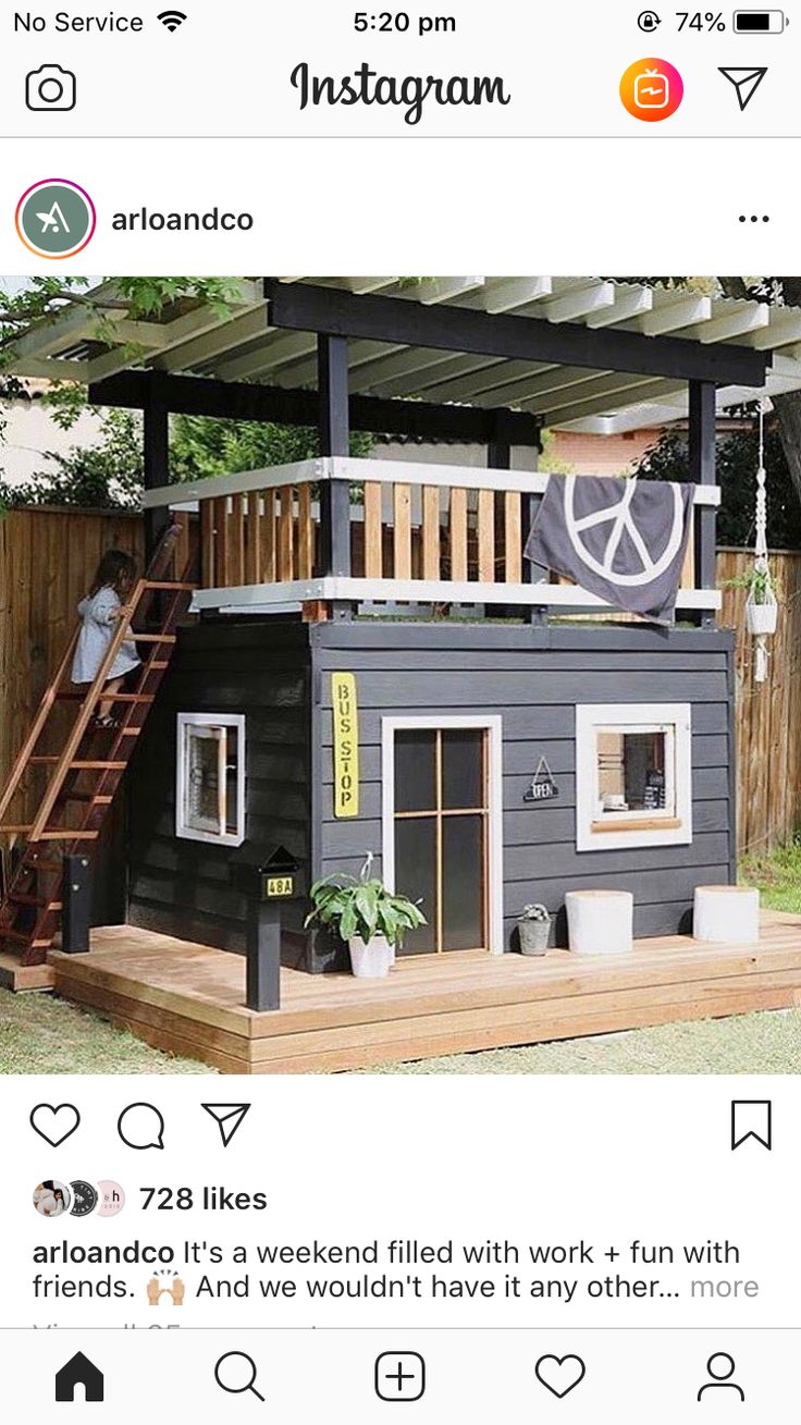 an instagramted photo of a tiny house on stilts with stairs to the roof