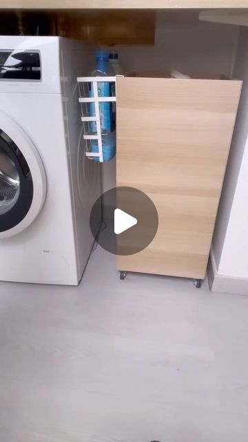 a washer sitting next to a dryer in a room