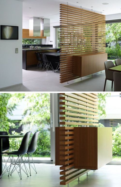 two pictures of an open kitchen and dining room with wooden slats on the wall