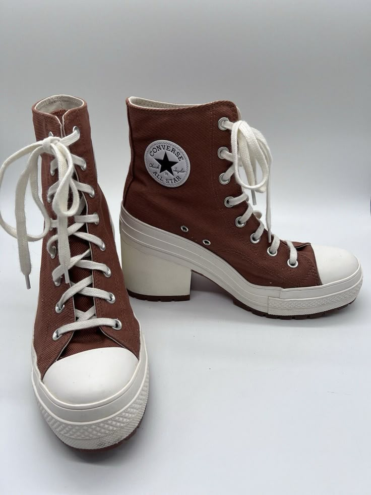 Elevate your casual style with these limited edition Converse Chuck 70 De Lux Heel Hi Pride sneakers. The tawny owl color with glitter accents adds a touch of uniqueness to any outfit. These high top sneakers have a lace-up closure for a secure fit and a rubber outsole for durability. The synthetic upper material is breathable and comfortable, while the foam insole provides added support. Perfect for walking, these athletic sneakers are suitable for all seasons. With a style code of A05253C and a US shoe size of 10 (women's 8), these Converse Chuck 70 sneakers are a must-have for any sneaker enthusiast. Shoes For Women Sneakers & Athletic, Converse High Heels, Pride Sneakers, Converse Heels, Real Outfits, Heel Sneakers, Therian Stuff, Tawny Owl, Hot Clothes