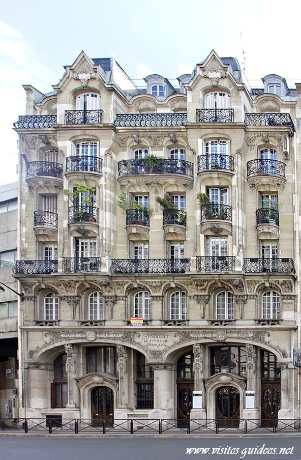 the building has many windows and balconies on it