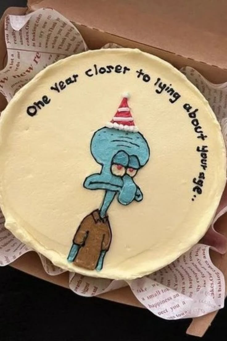 a birthday cake with an image of the smurf on it