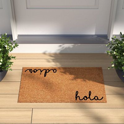 a door mat with the word hello written on it