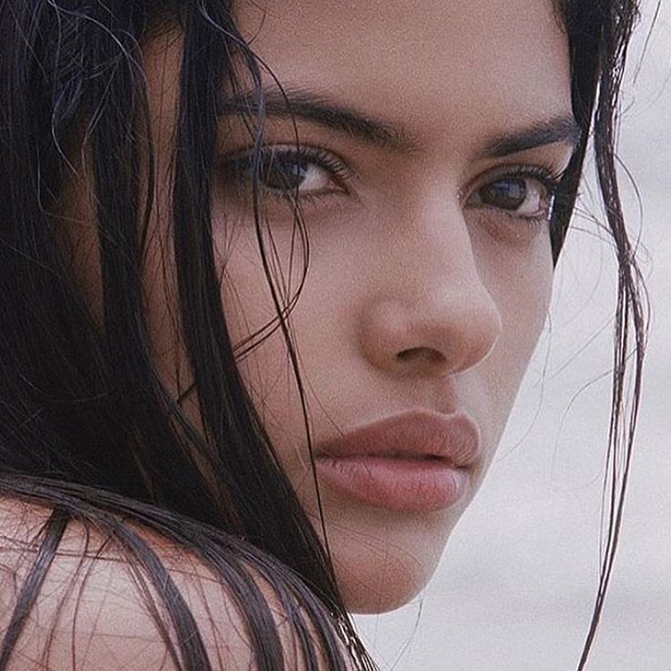 a close up of a woman with wet hair