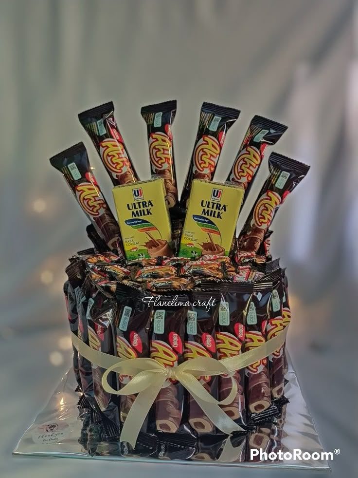 a cake with chocolates and candies on it