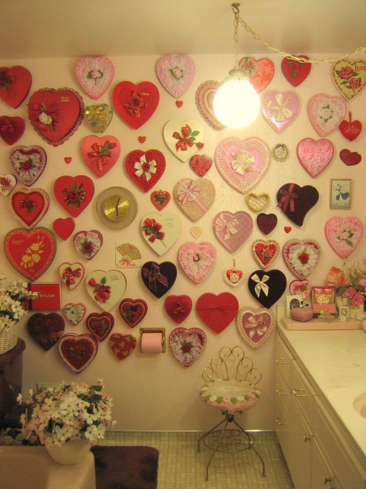 a bathroom decorated with lots of heart shaped magnets