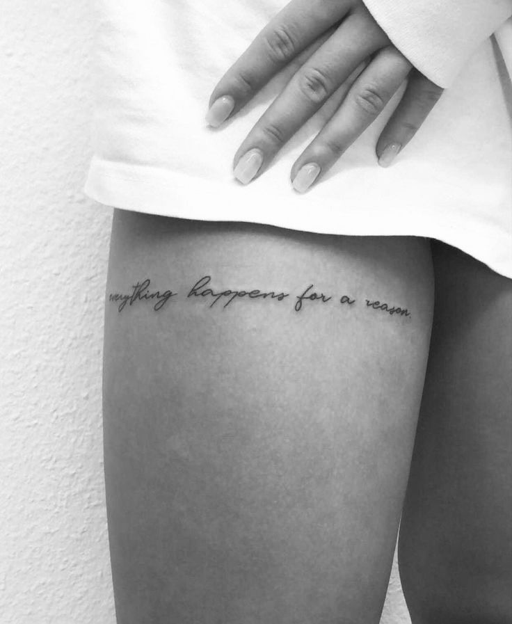 a woman's thigh with the words, everything happens for a reason written on it