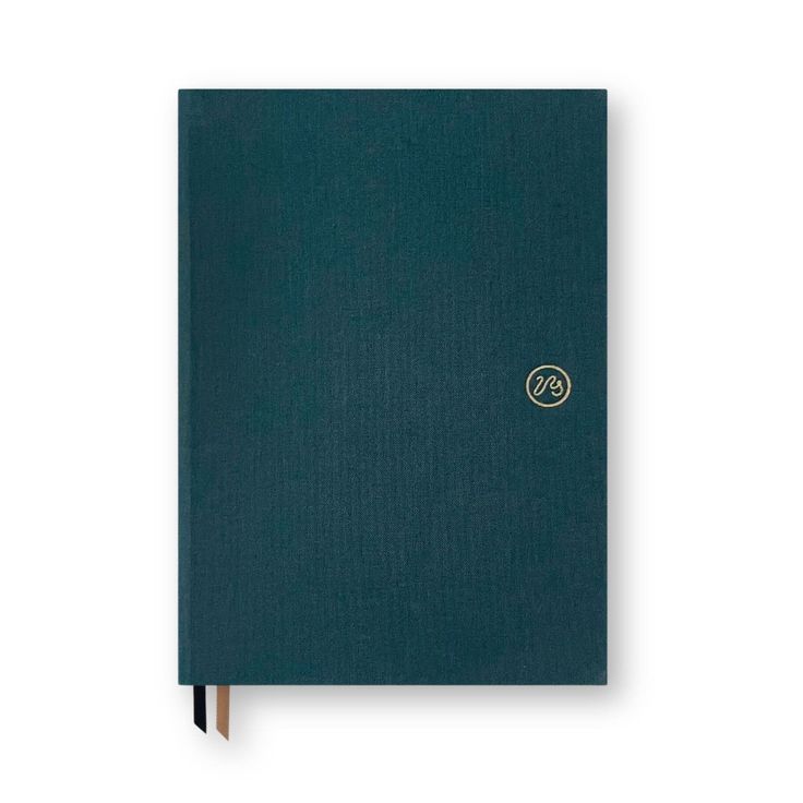 a blue notebook with a gold logo on the cover