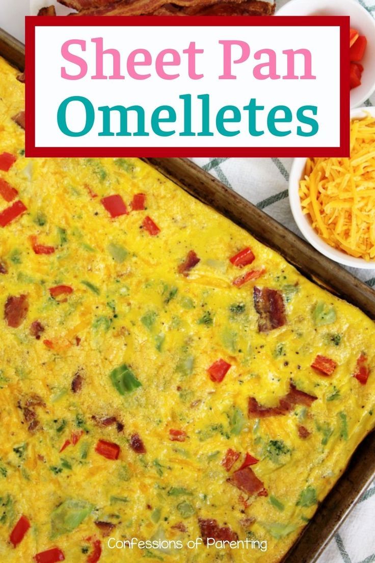 an omelette with bacon and cheese on it in a pan next to other breakfast foods