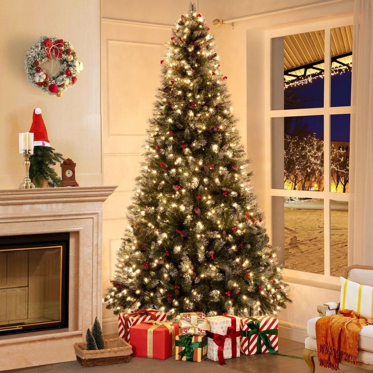 a decorated christmas tree in front of a fireplace