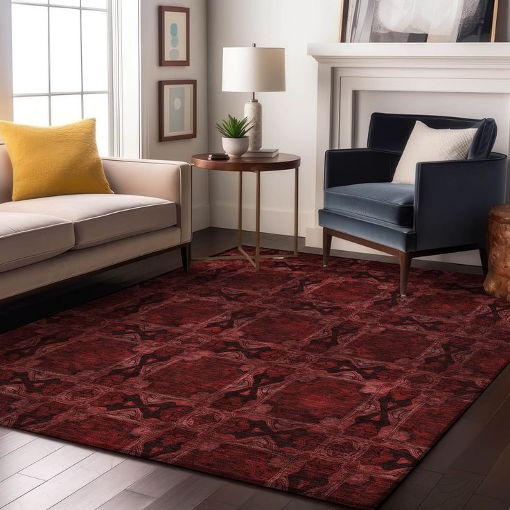 a living room area with couches, chairs and a rug on the floor in front of a fireplace