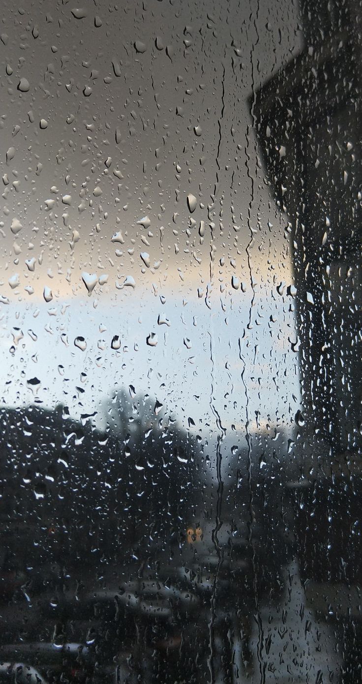 rain drops on the window as it is raining