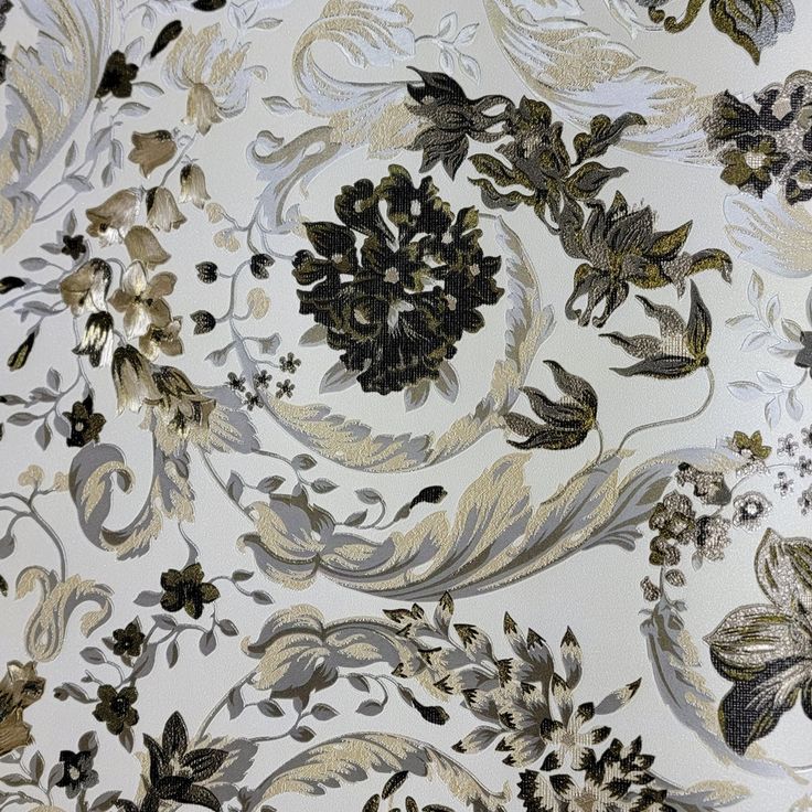 a white and gold floral wallpaper with black, grey, and yellow flowers on it