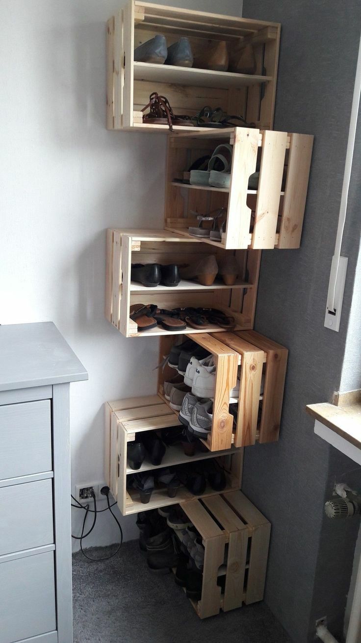 a room with some wooden shelves and shoes