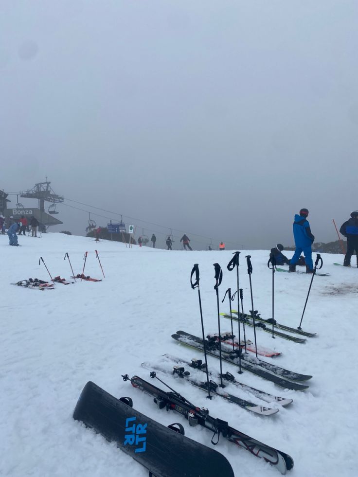 there are many skis and poles in the snow