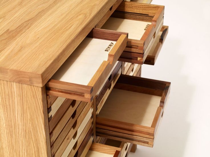 the drawers are made from wood and have many compartments for each drawer to hold items