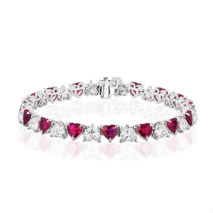 For Sale on 1stDibs - Gorgeous and Unique Ruby and Diamond Bracelet. 16 Heart Shaped Rubies weighing 10.20 Carats. 16 Heart Shaped Diamonds weighing 8.15 Carats. Set in Platinum. Luxury Diamond Heart Bracelet For Anniversary, Diamond Accented Bracelets For Valentine's Day Wedding, Wedding Bracelets With Diamond Accents For Valentine's Day, Anniversary Tennis Bracelet For Valentine's Day, Valentine's Day Anniversary Tennis Bracelet, Luxury White Gold Heart Bracelet For Wedding, Formal Heart-shaped Diamond Accented Bracelet, Formal Heart Cut Bracelet With Diamond Accents, Formal Heart Bracelet With Diamond Accents