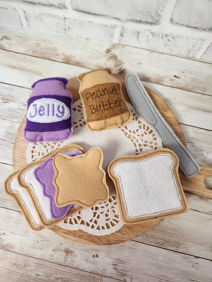 a plate with cookies, butter and jelly on it