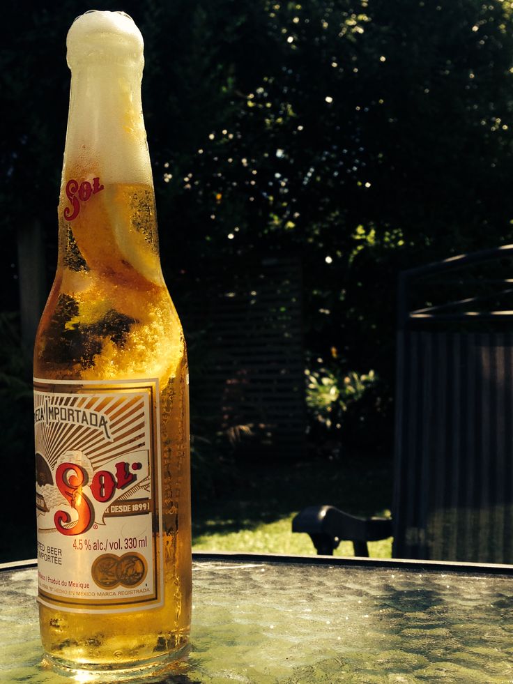 a bottle of beer sitting on top of a table