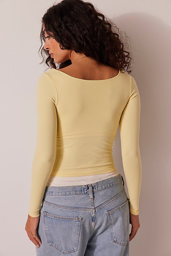 A soft and seamless essential, this go-to long sleeve features a square neckline and formfitting silhouette. **Fit:** Formfitting, fitted sleeves, slightly cropped **Features:** Soft fabrication, seamless design, square neckline **Why We | Clean Lines Long Sleeve by Intimately at Free People in Yellow, Size: XS/S Free People Basics, Free People Shirts, Where To Buy Tops, Light Yellow Top, Yellow Long Sleeve Shirt, Conan Grey, Yellow Clothes, Yellow Tops, Free People Long Sleeve