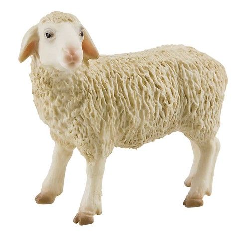 a toy sheep standing on top of a white surface