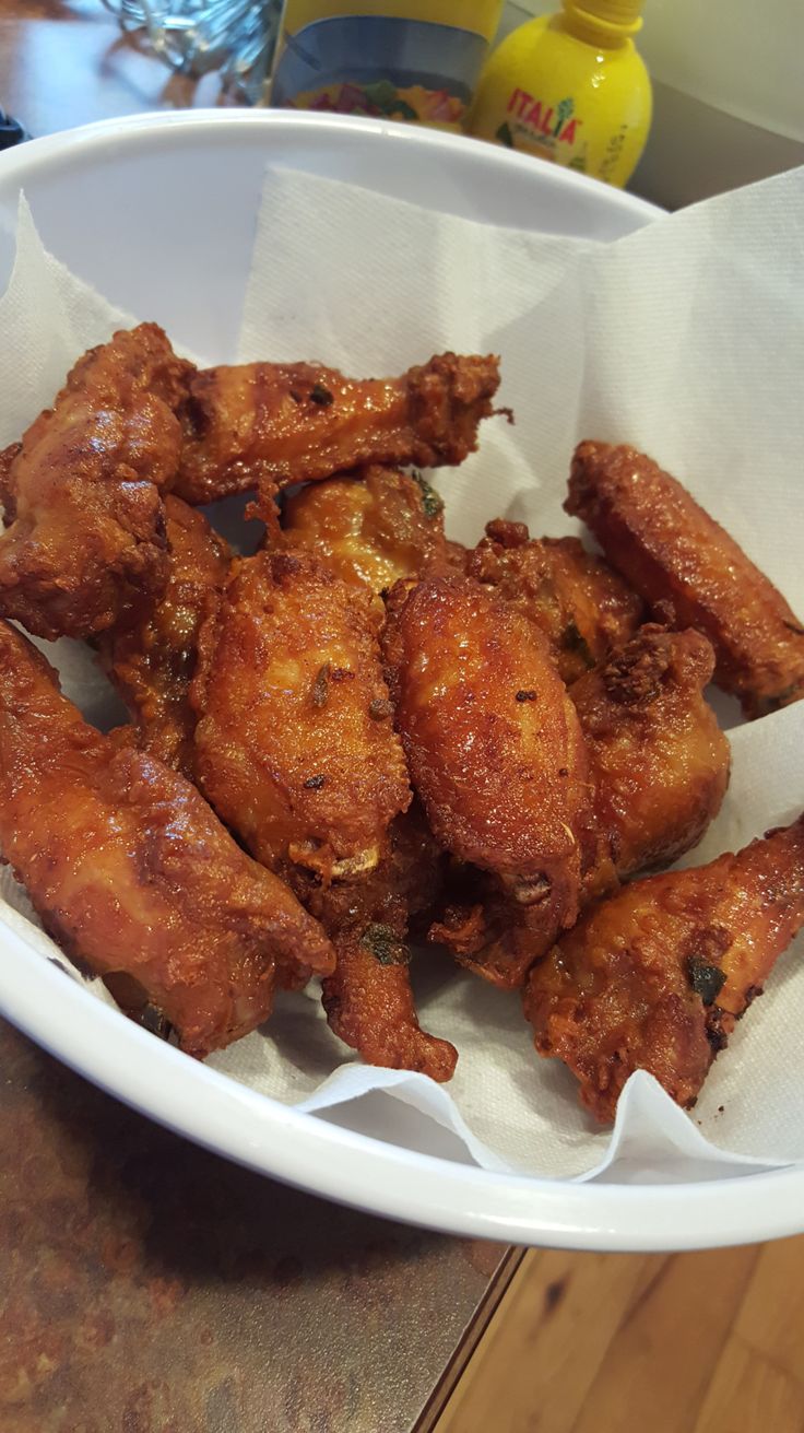 some fried food in a white bowl on a table