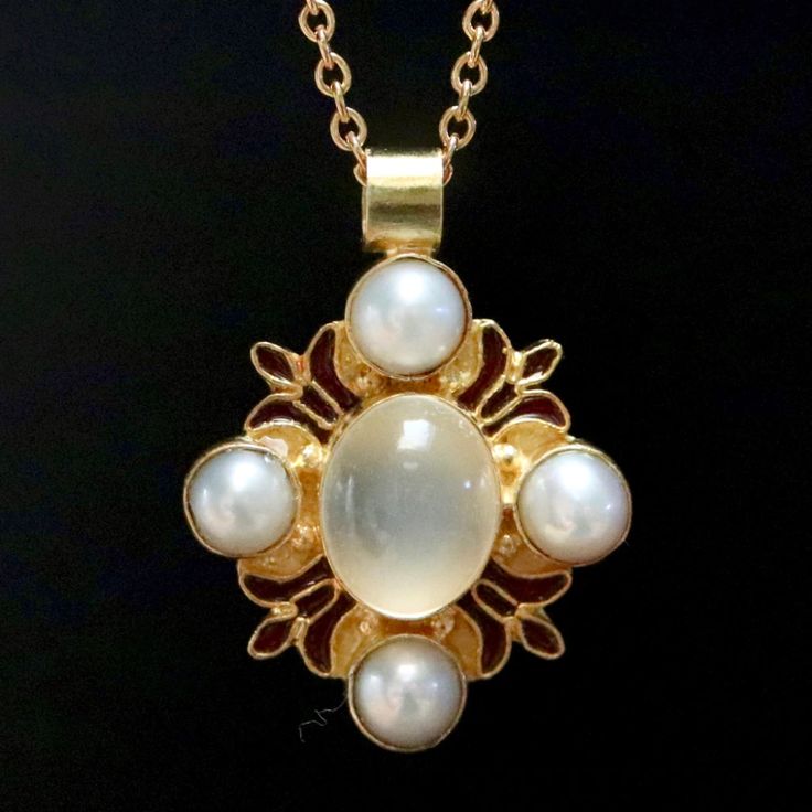 The visual equivalent of beautiful Italian song, this Renaissance design is pure harmony. Hand polished moonstone and cultured pearls with red enameled fleurs-de-lys. 24k gold over sterling silver with 14" chain. Pearl And Gold Jewelry, Half Mermaid, Diffraction Of Light, House Velaryon, Regency Jewelry, Song Night, Gift Ornaments, Siren Song, Pendant Designs