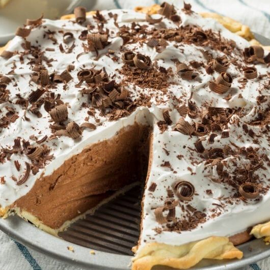 a chocolate pie with one slice cut out