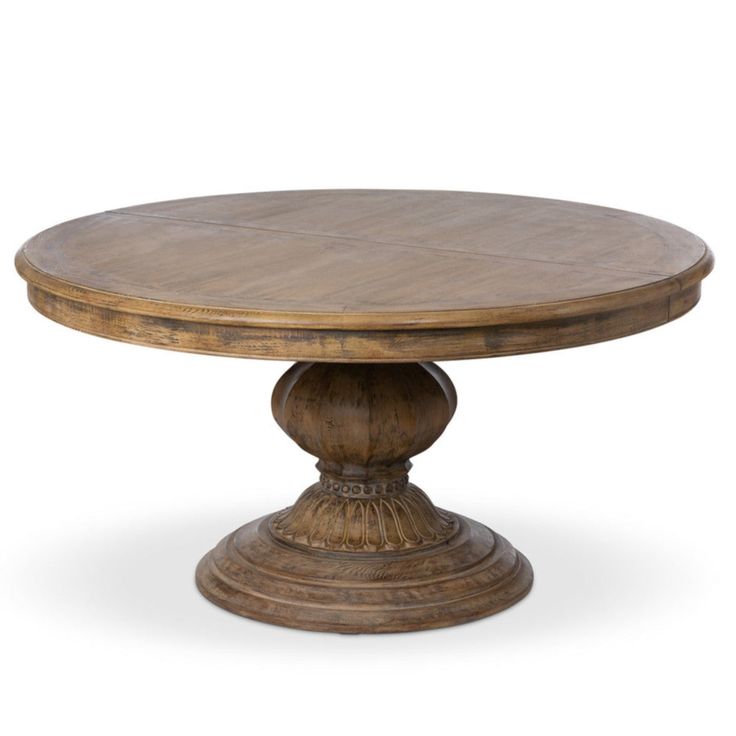 an oval wooden table with two pedestals