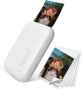 a polaroid printer with four photos on it and the cover opened to show two people's faces