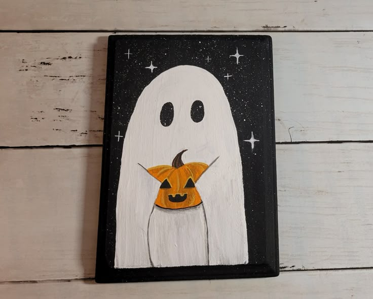 a painting of a ghost holding a jack - o - lantern on a white wooden background