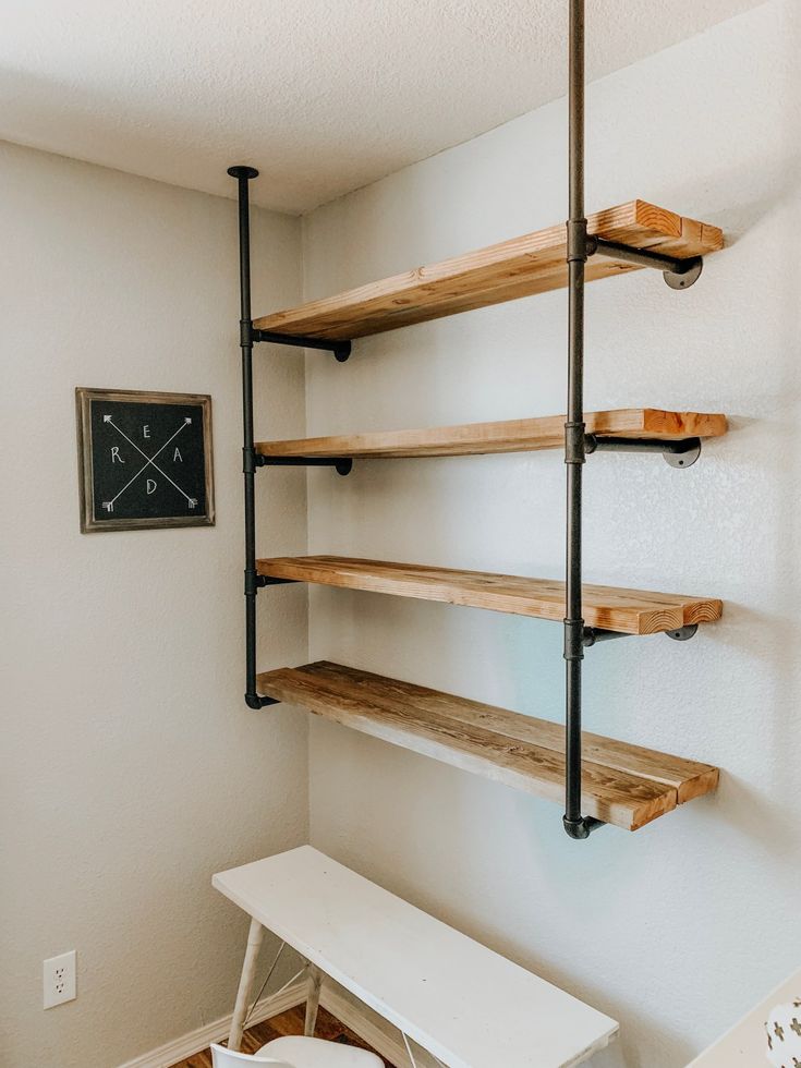 a room with some shelves and a clock on the wall